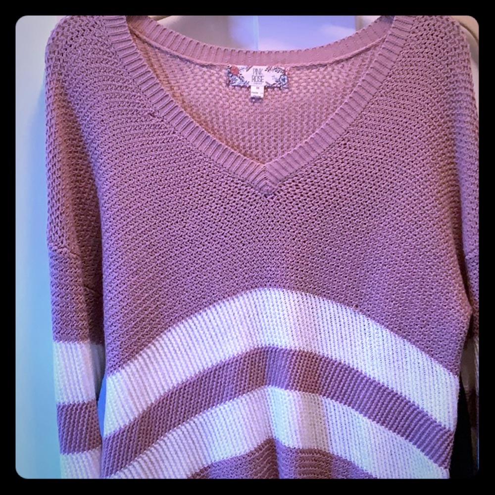 It’s and comfy oversized mauve sweater